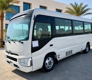 Toyota Coaster 2025 — OneClickDrive